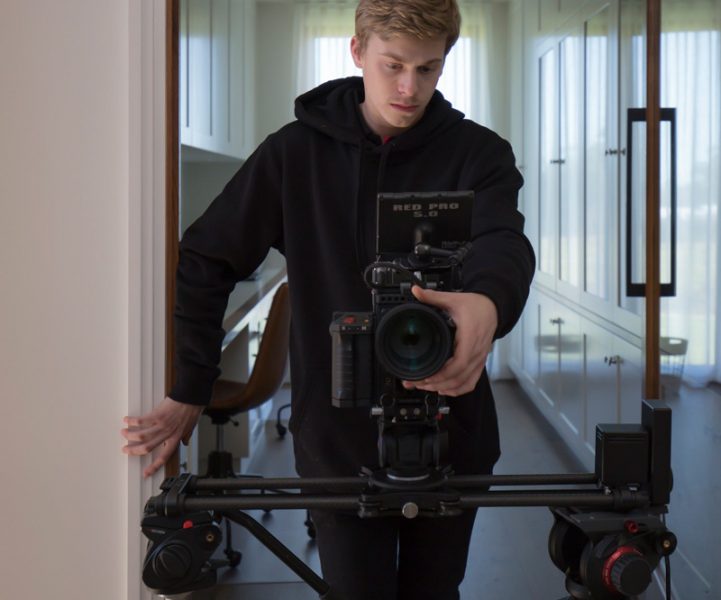 Cameraman filming in the hall — Video Production Services in Toowoomba